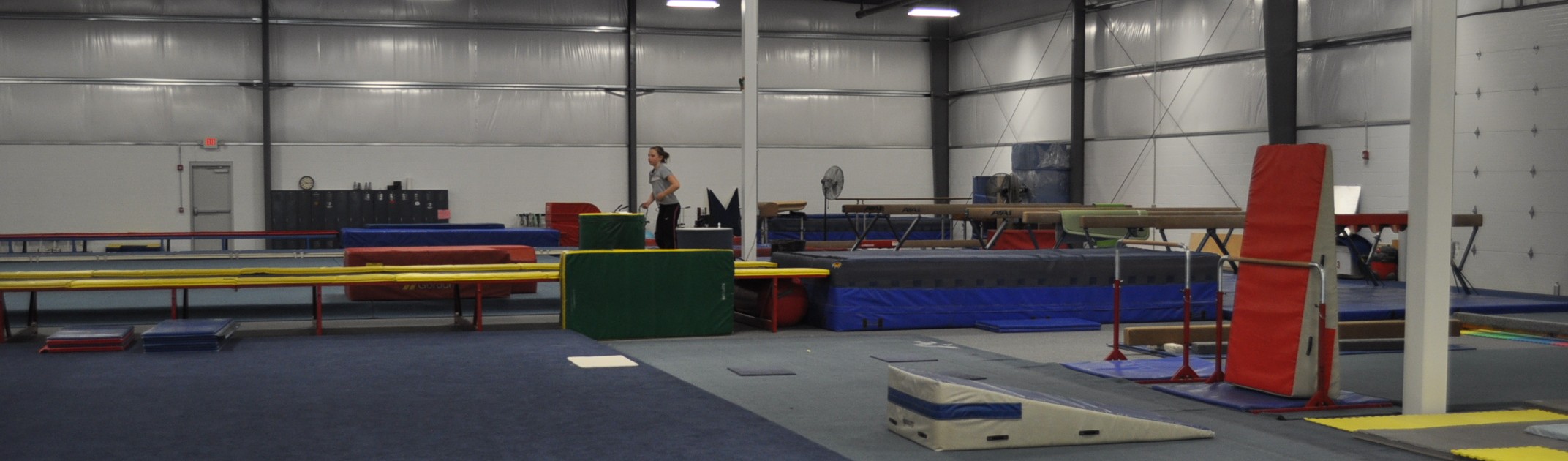 Interior of clear-span metal building built out as a gymnastics training facility